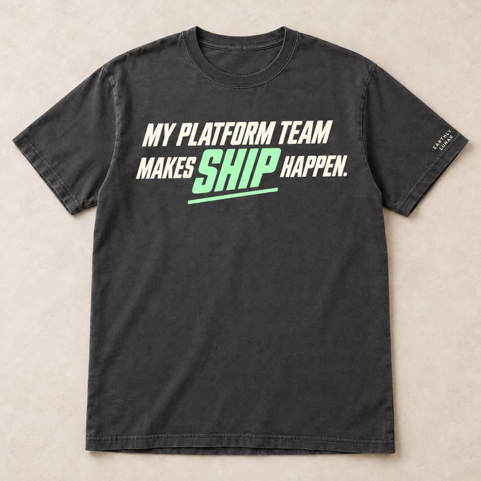 Charcoal tee with 'MY PLATFORM TEAM MAKES SHIP HAPPEN.' in slanted cream capitals, 'SHIP' bigger and in mint