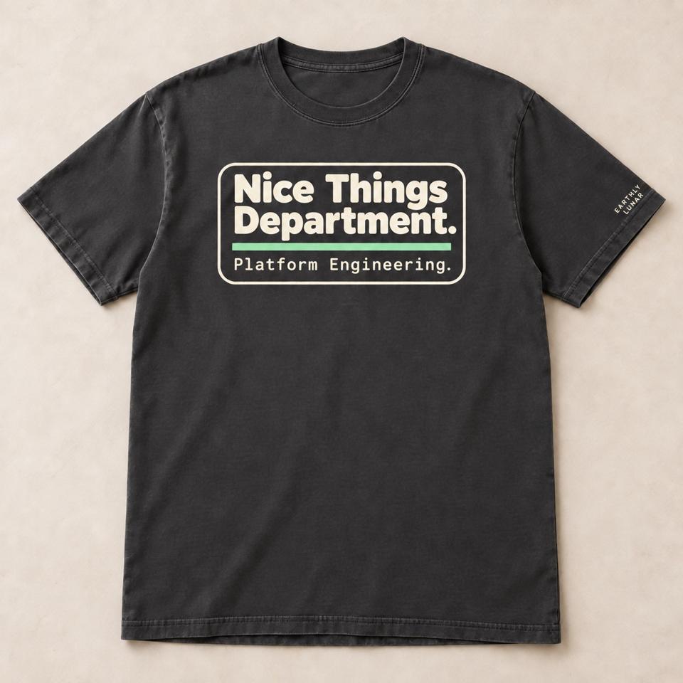 Charcoal tee with a cream-outlined badge reading 'Nice Things Department.' over a mint bar and 'Platform Engineering.'